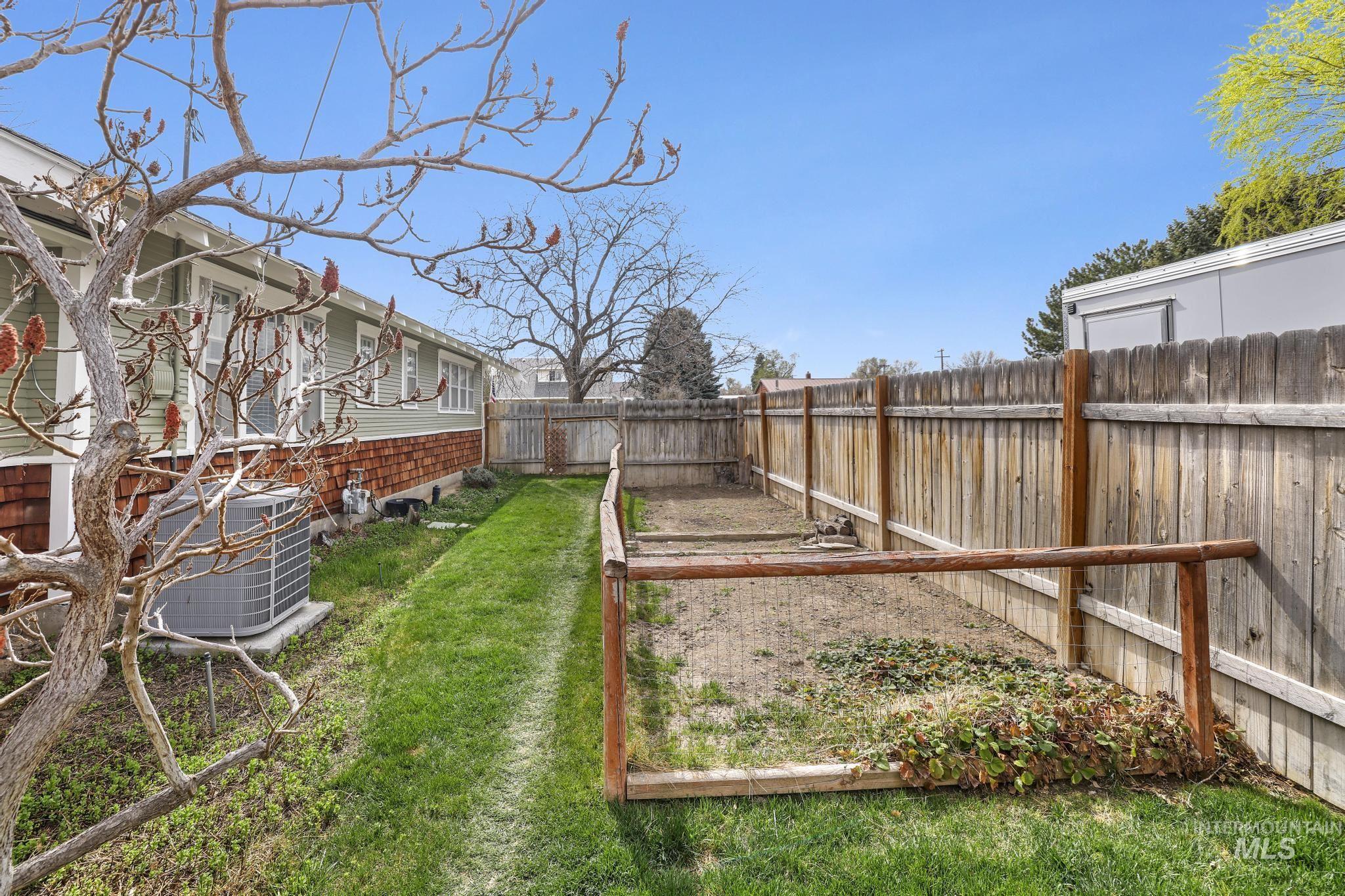 502 6th Street Filer, ID 83328 - Photo 31 of 41 Fenced backyard featuring a garden