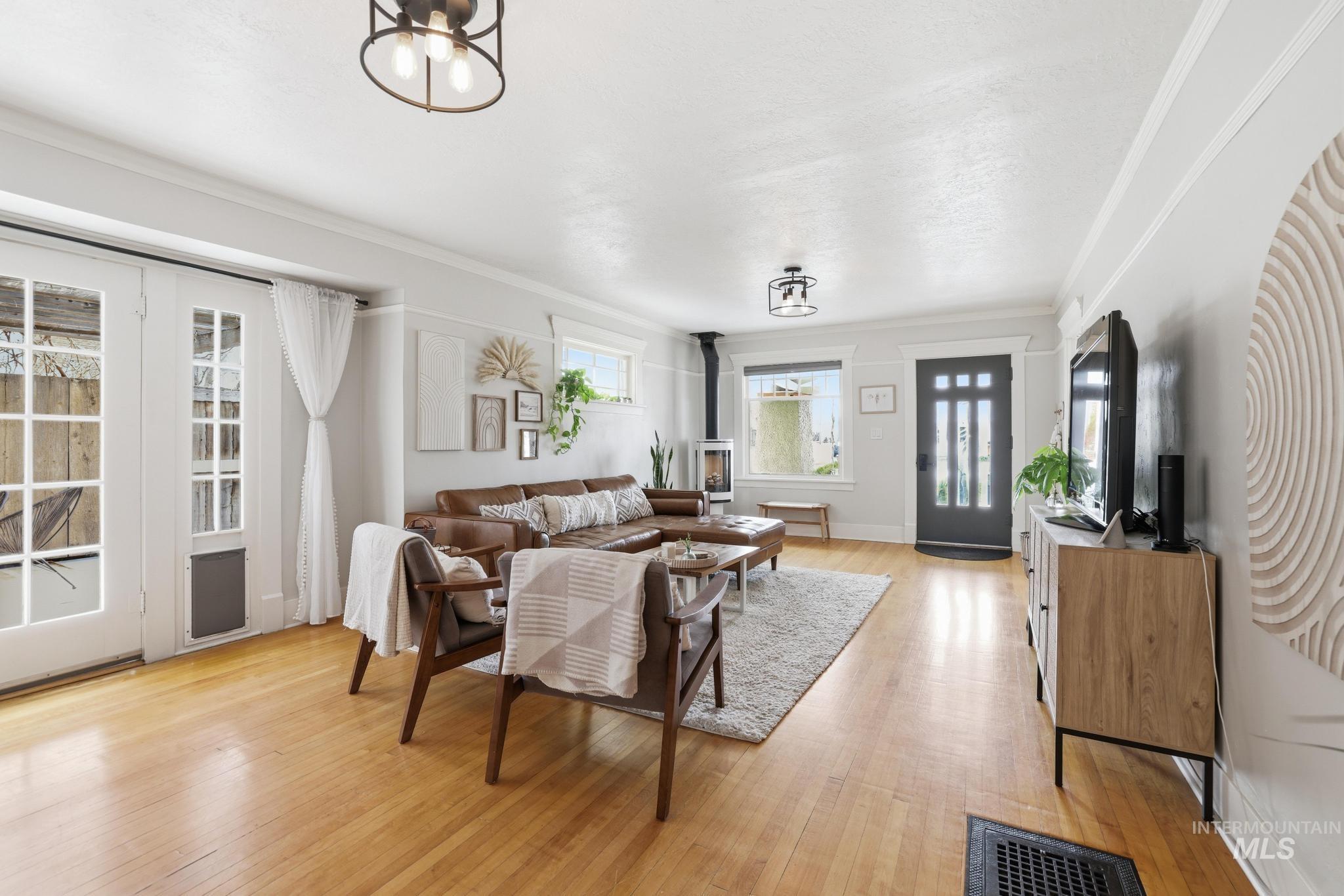 502 6th Street Filer, ID 83328 - Photo 6 of 41 Living area with light wood-style floors and ornamental molding