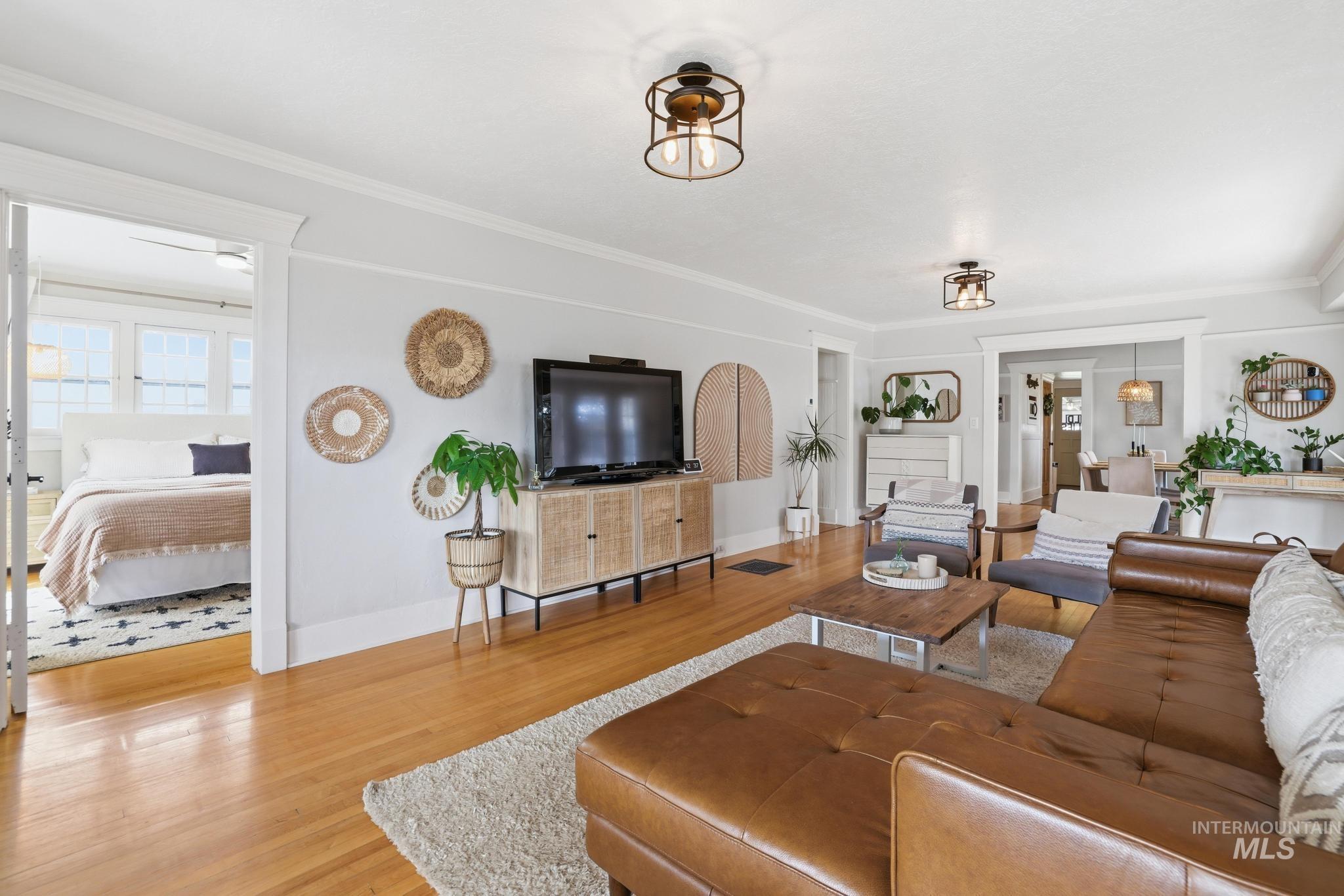 502 6th Street Filer, ID 83328 - Photo 8 of 41 Living room with light wood finished floors and crown molding