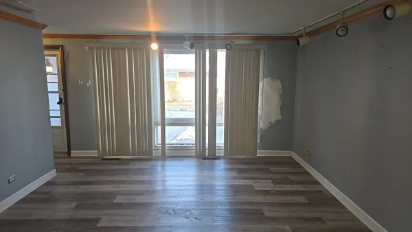 a view of entryway with wooden floor
