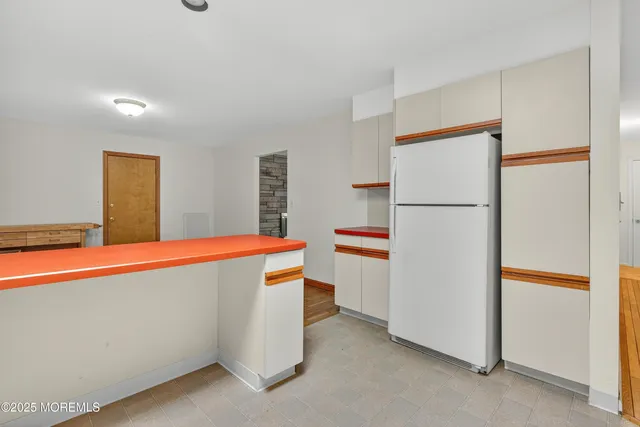 a view of kitchen with wooden floor