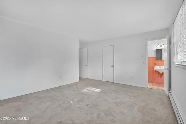 a bathroom with a sink a mirror and shower