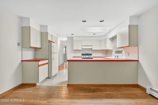 a kitchen with counter top space and cabinets