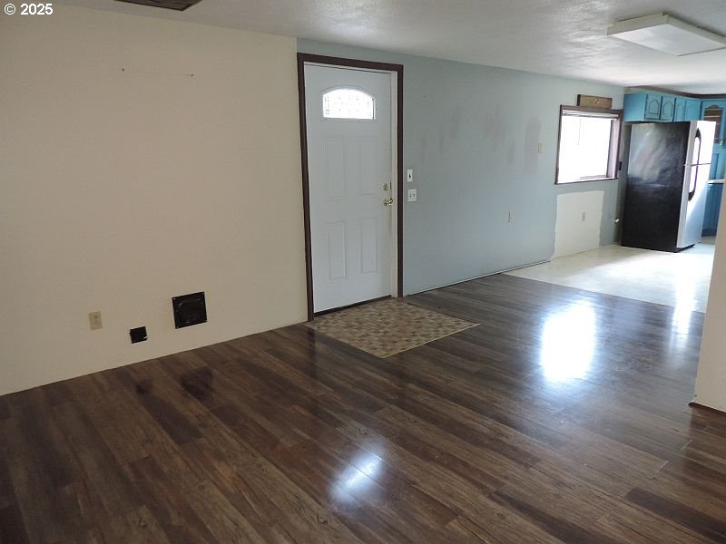 1525 Highway 97 Goldendale, WA 98620 - Photo 24 of 46 an empty room with wooden floor and windows