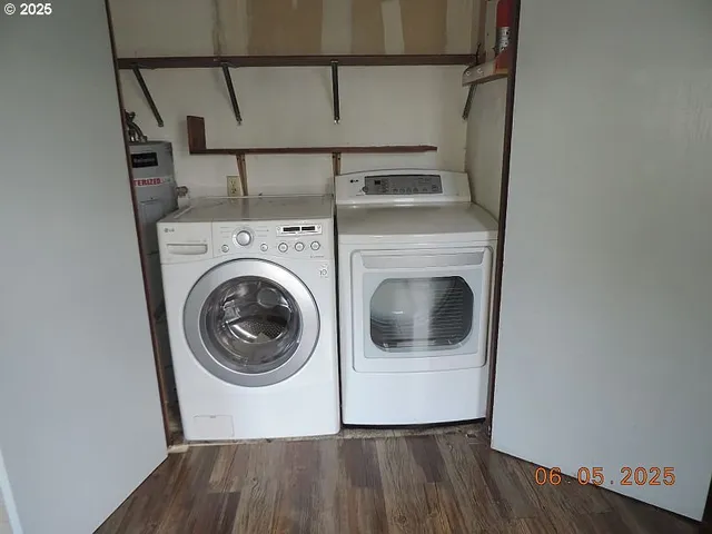 a view of a hallway with washer and dryer