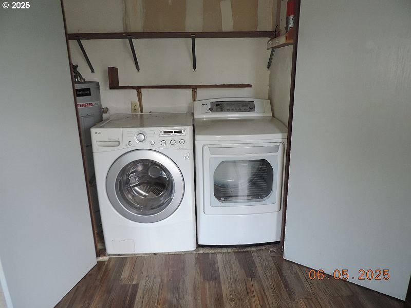 1525 Highway 97 Goldendale, WA 98620 - Photo 27 of 46 a view of a hallway with washer and dryer