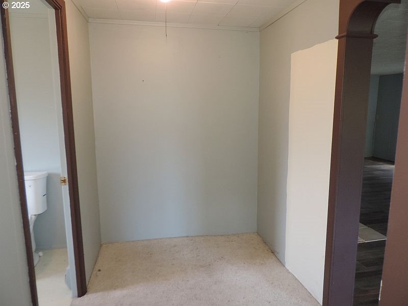 1525 Highway 97 Goldendale, WA 98620 - Photo 31 of 46 an empty room with wooden floor