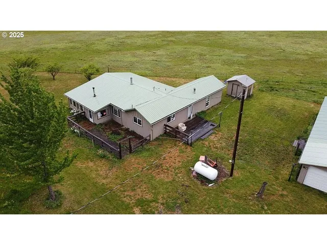 a aerial view of a house with a swimming pool