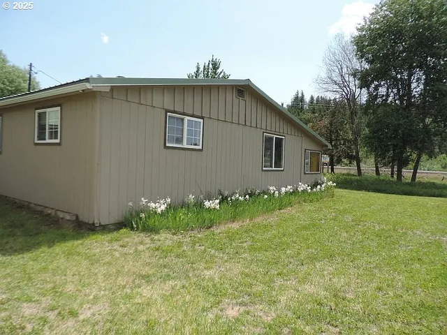 a backyard of a house with lots of green space