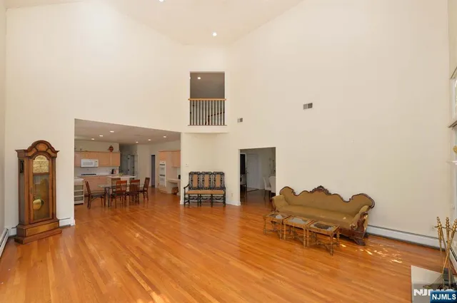 a room with furniture pool table and chairs