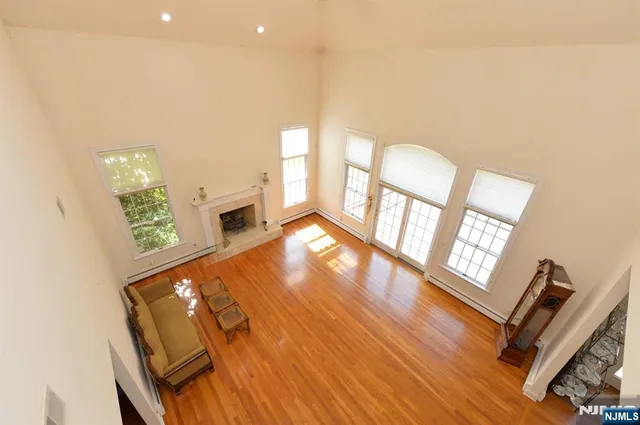 a view of an entryway with wooden floor