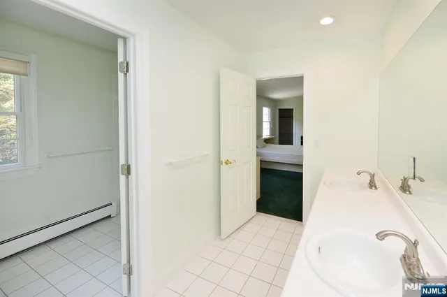 a bathroom with a bathtub and a sink