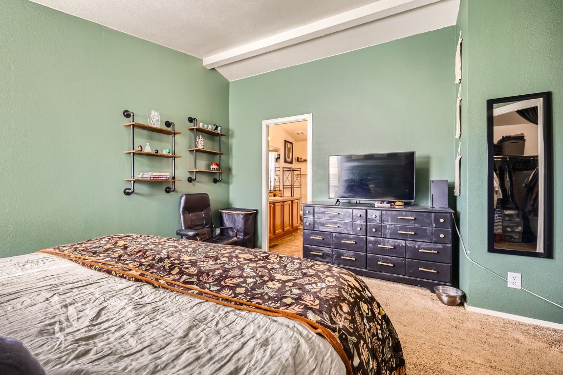 105 Red Cloud Peak Drive Dillon, CO 80435 - Photo 12 of 28 a bedroom with a bed and a flat screen tv