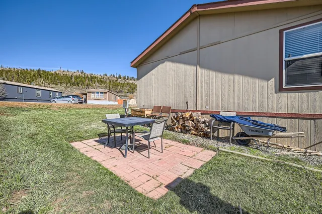 a view of a backyard with sitting area