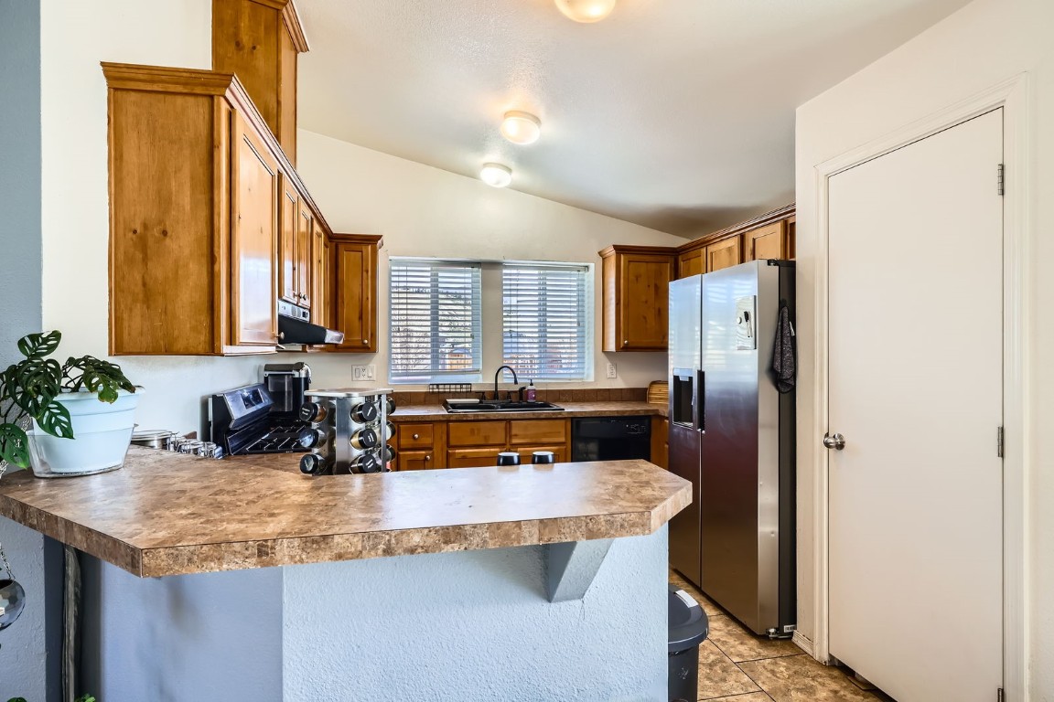 105 Red Cloud Peak Drive Dillon, CO 80435 - Photo 7 of 28 a kitchen with refrigerator and cabinets