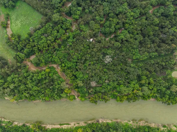a view of a field with an ocean view