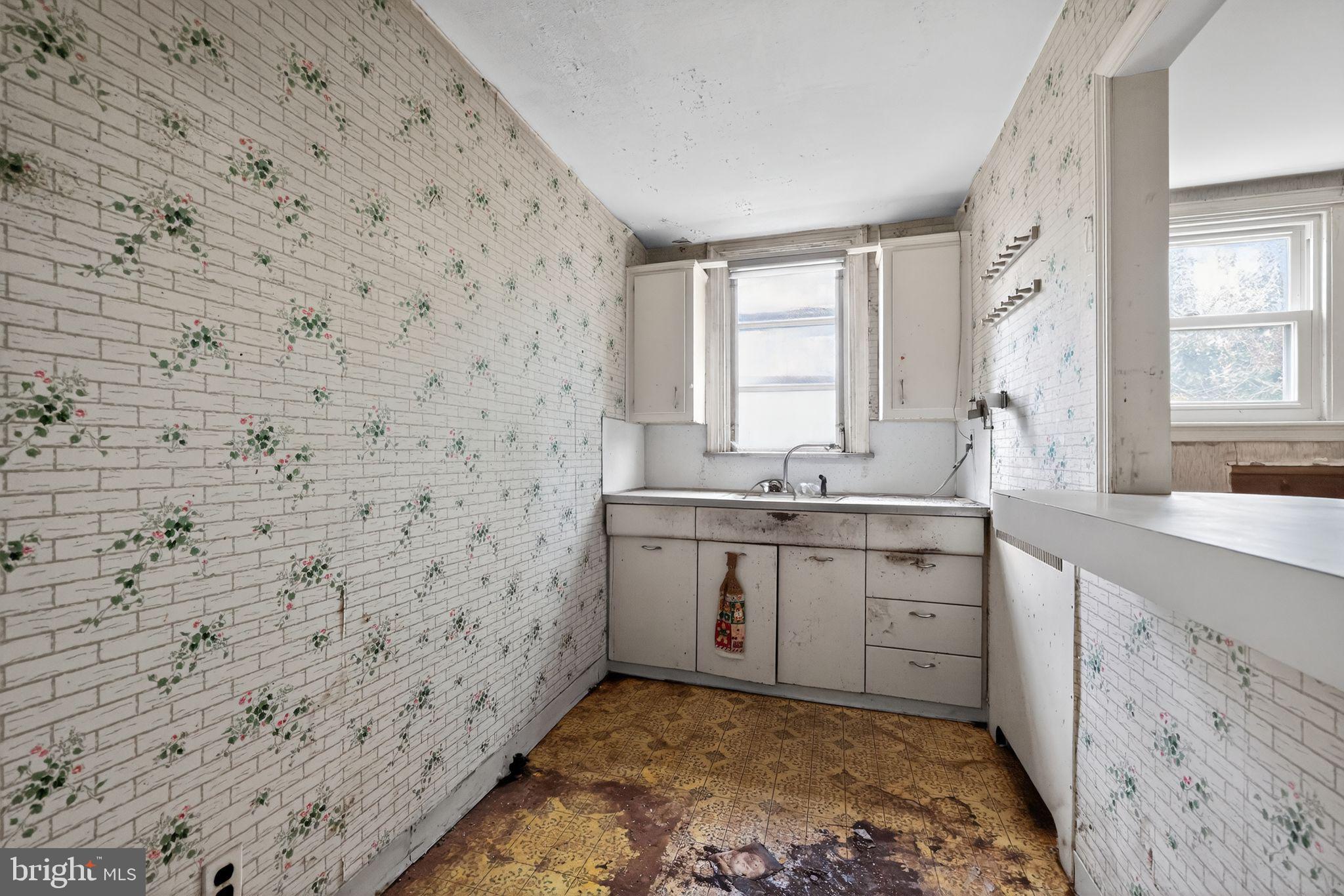 7181 Ruskin Lane Upper Darby, PA 19082 - Photo 11 of 30 a bathroom with a sink a vanity and a mirror