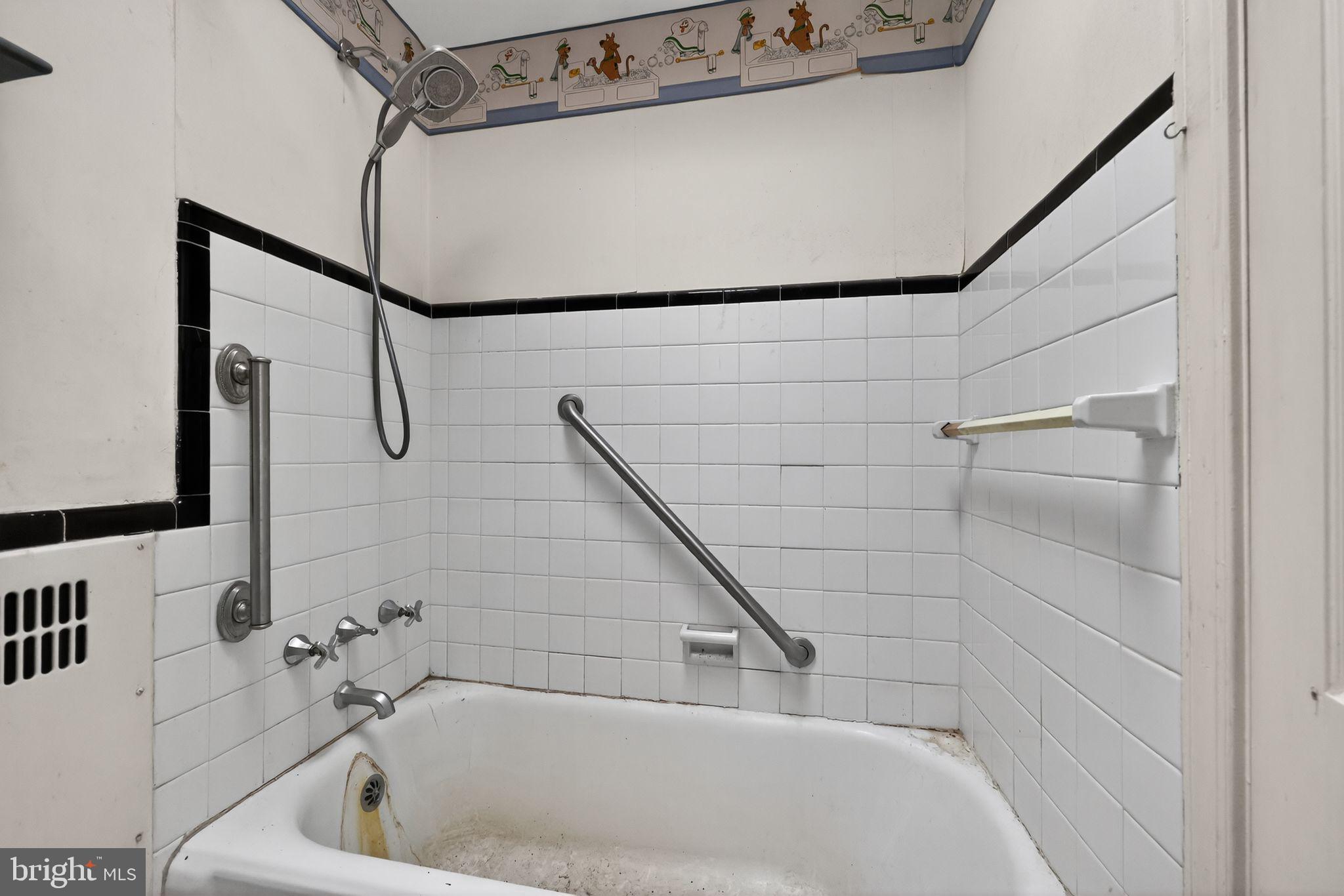 7181 Ruskin Lane Upper Darby, PA 19082 - Photo 14 of 30 a bathroom with a white bath tub and a shower