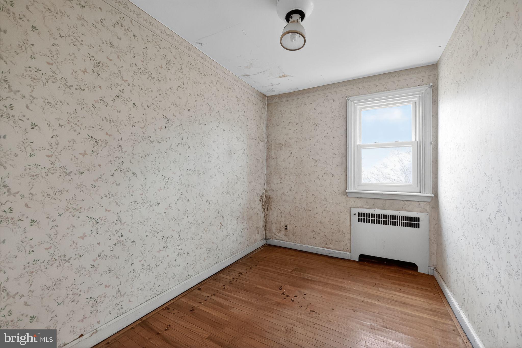 7181 Ruskin Lane Upper Darby, PA 19082 - Photo 17 of 30 an empty room with wooden floor and windows