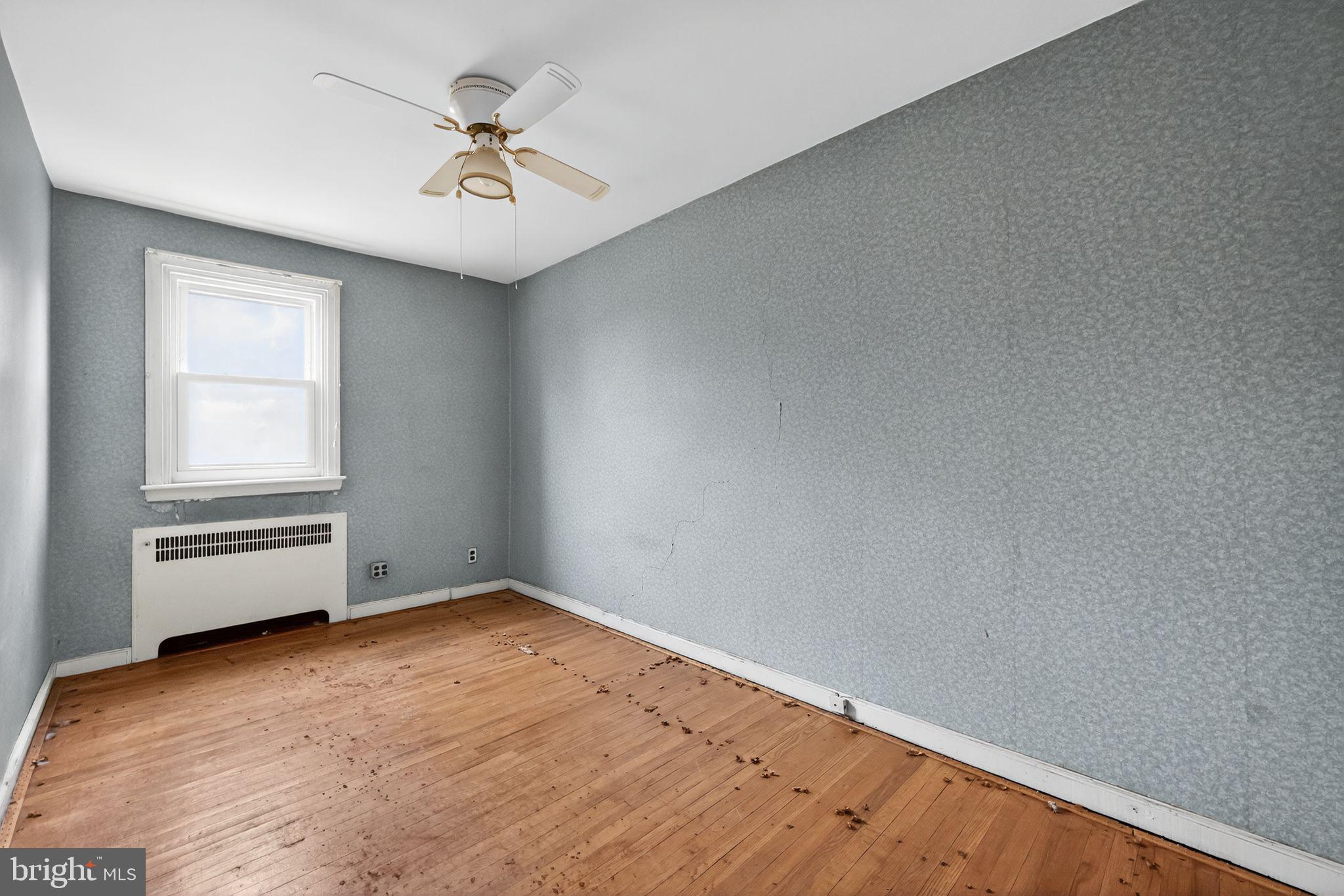 7181 Ruskin Lane Upper Darby, PA 19082 - Photo 19 of 30 an empty room with a window and a ceiling fan