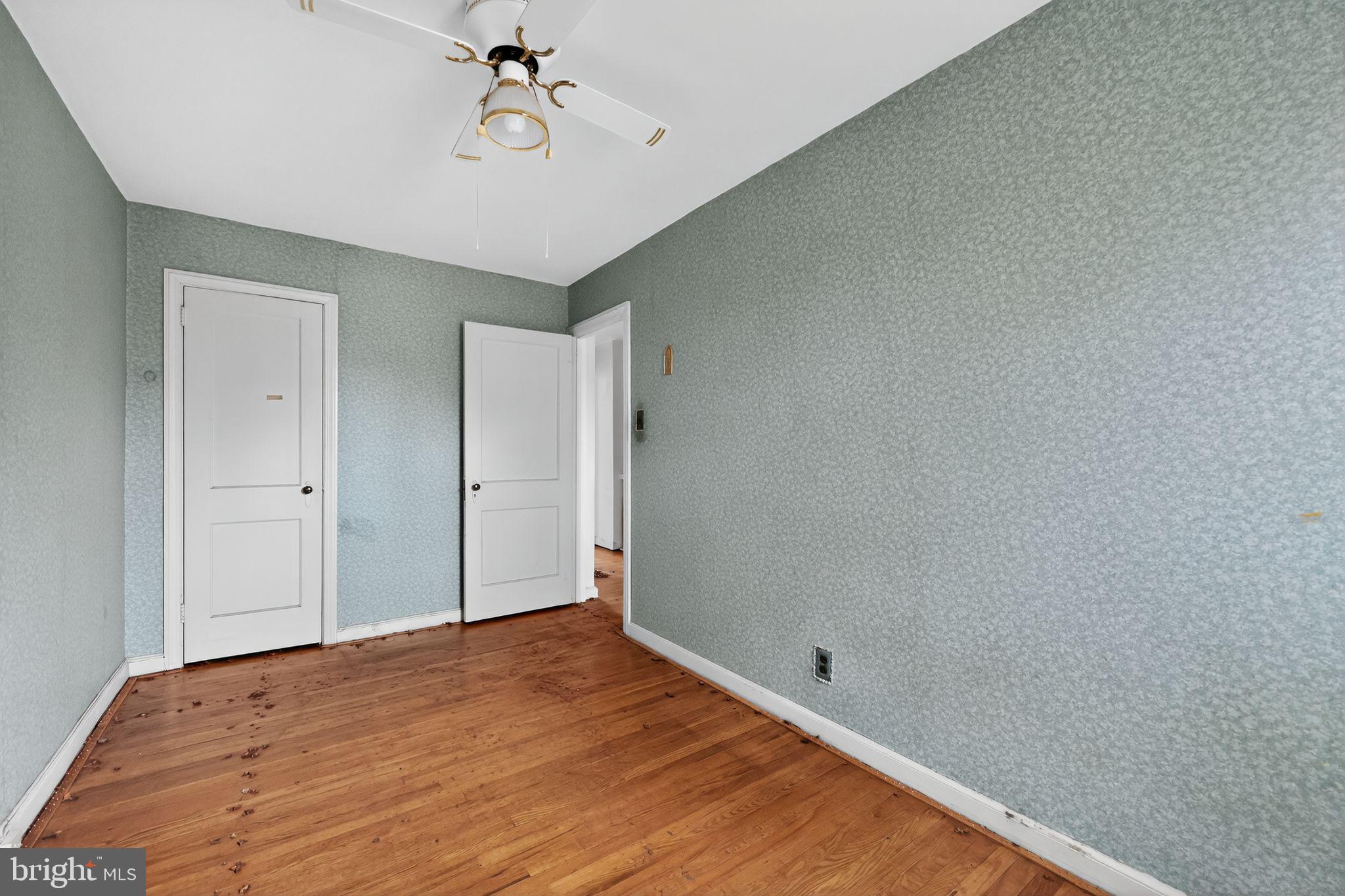 7181 Ruskin Lane Upper Darby, PA 19082 - Photo 20 of 30 a view of a room with wooden floor and ceiling fan