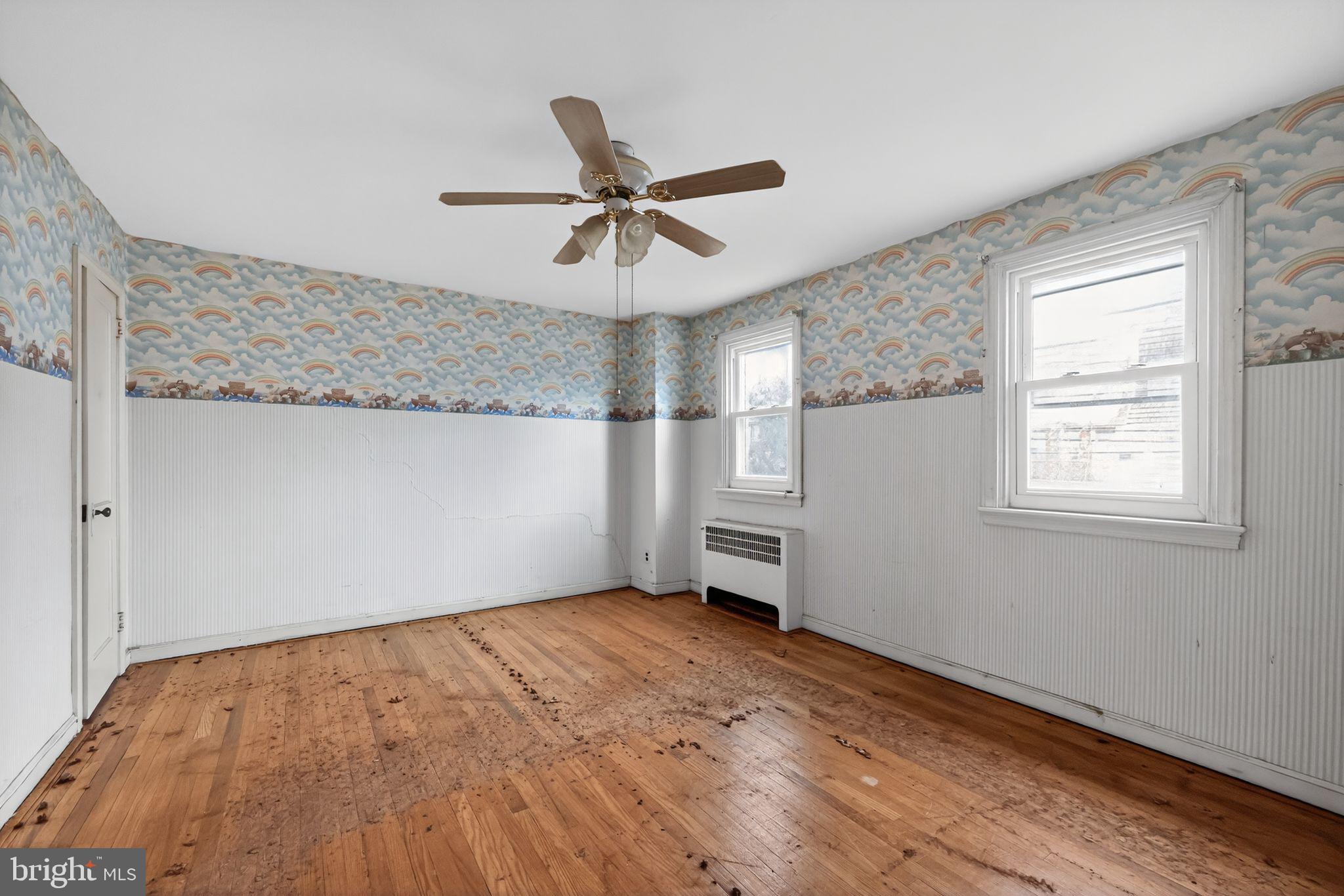 7181 Ruskin Lane Upper Darby, PA 19082 - Photo 21 of 30 a view of empty room with wooden floor and fan