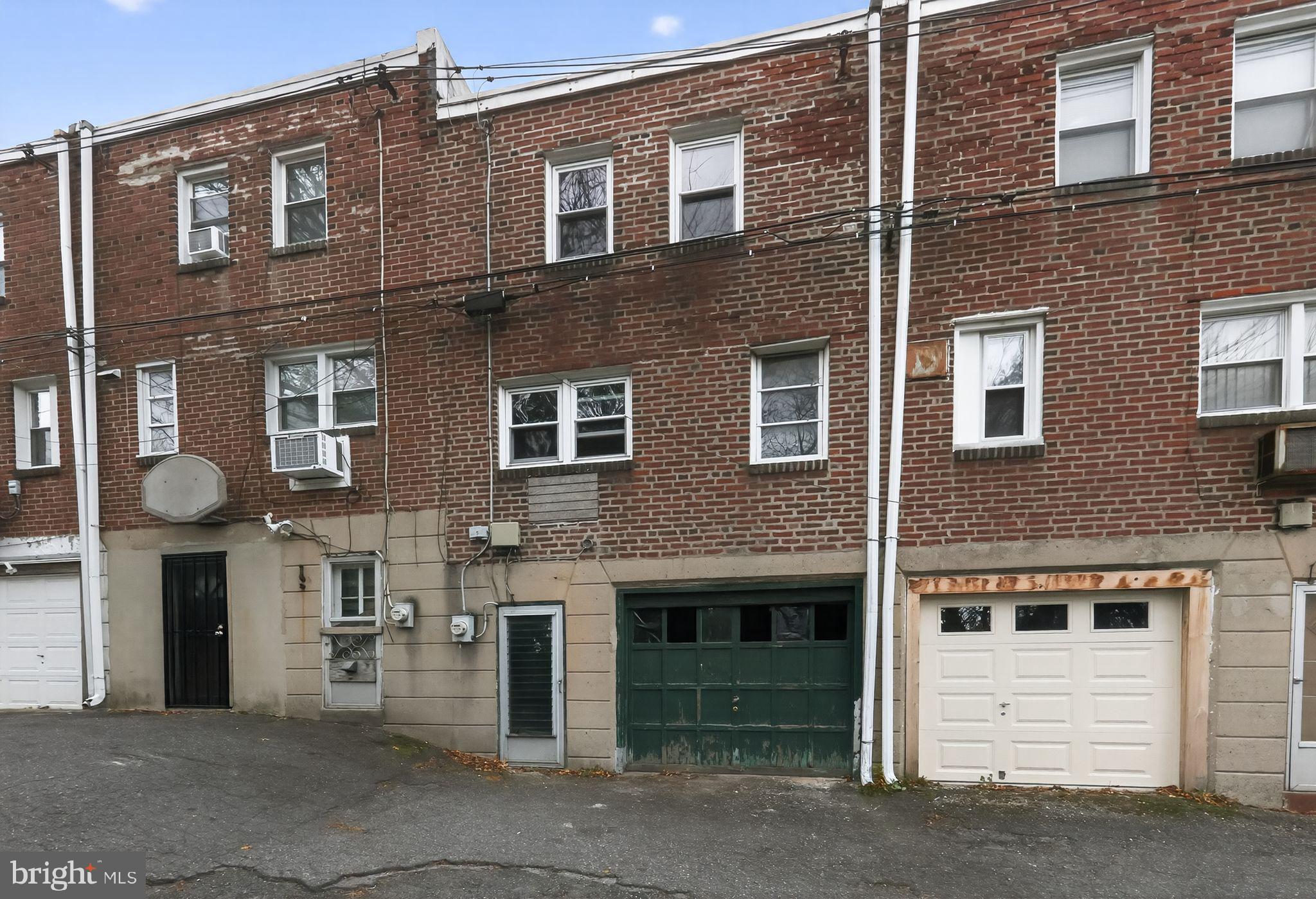7181 Ruskin Lane Upper Darby, PA 19082 - Photo 26 of 30 a front view of a building with a garage