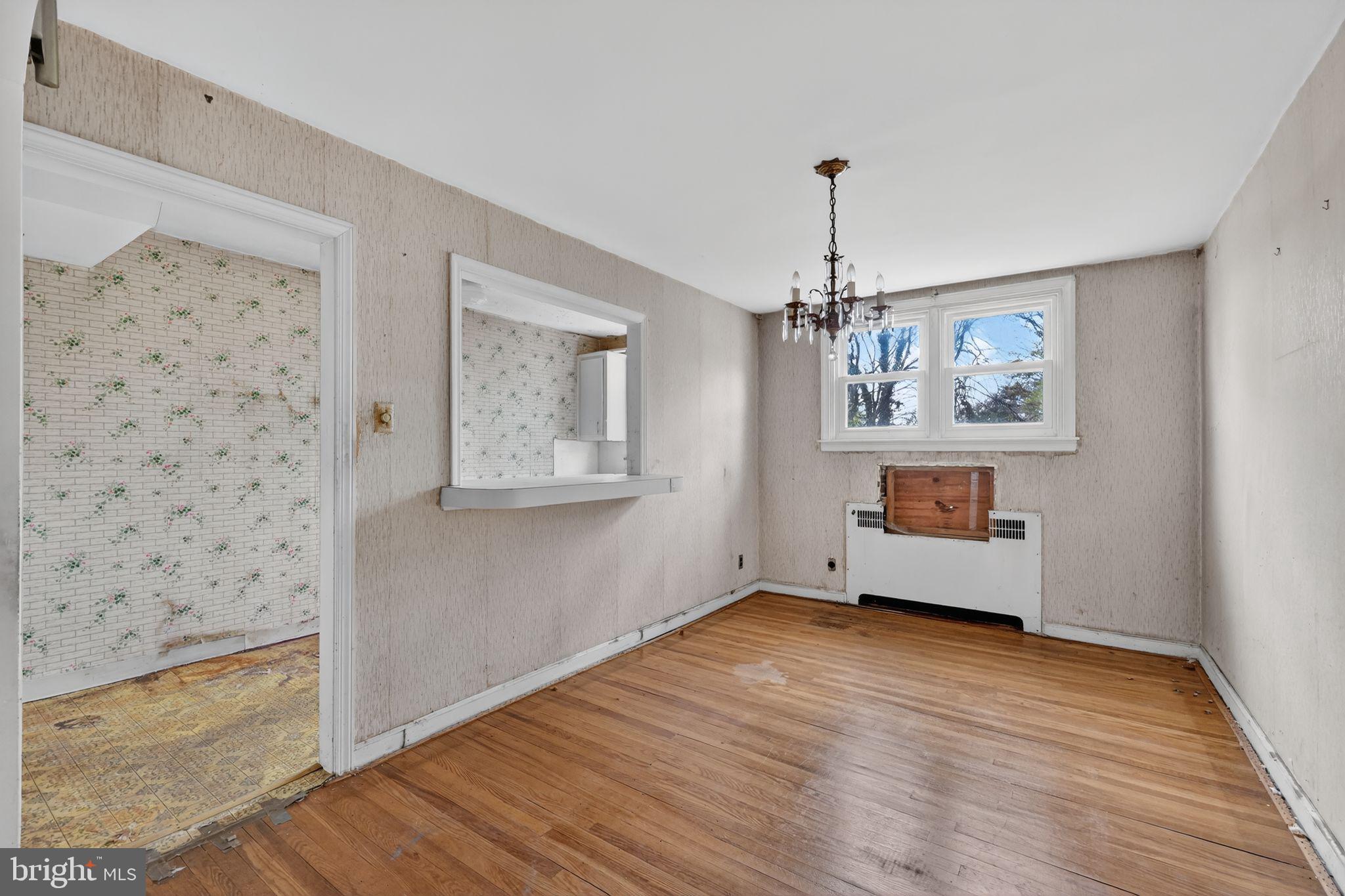 7181 Ruskin Lane Upper Darby, PA 19082 - Photo 8 of 30 wooden floor in an empty room with a window