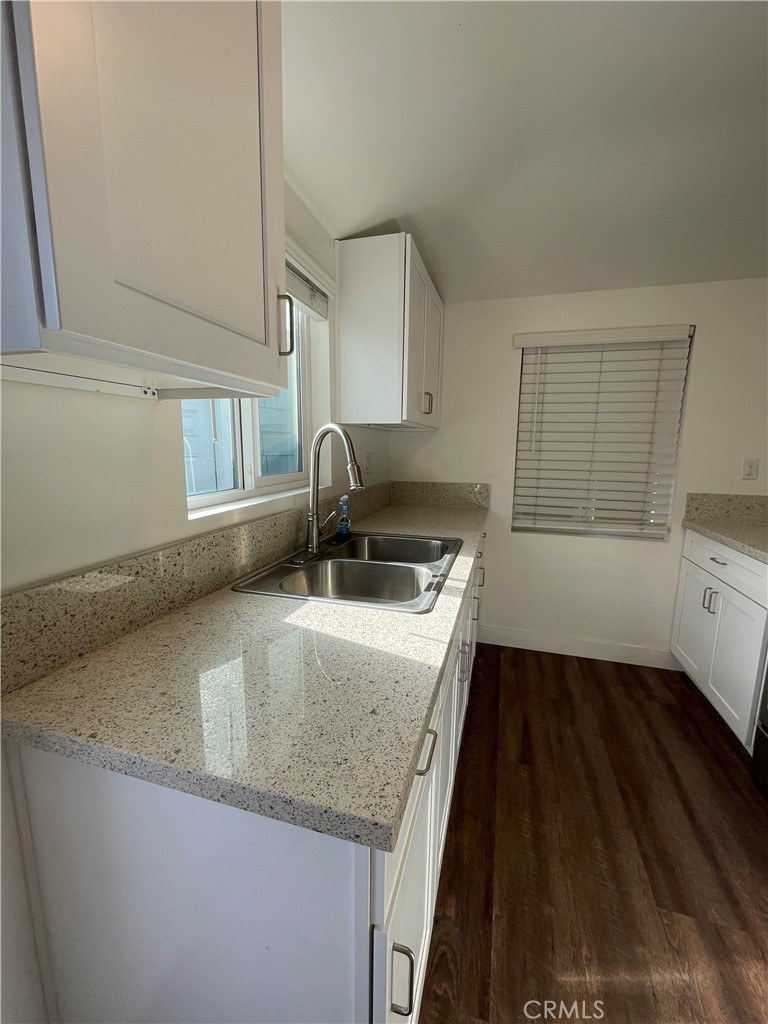 8536 5th Street Downey, CA 90241 - Photo 5 of 13 a kitchen with a sink and cabinets