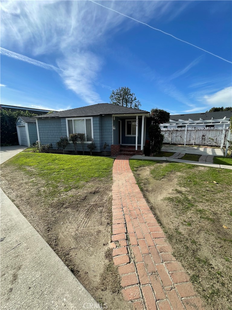 8536 5th Street Downey, CA 90241 - Photo 10 of 13 a front view of a house with a yard