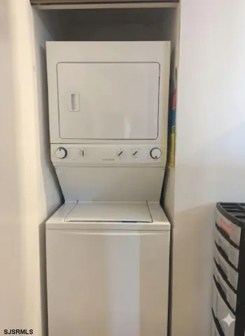a lobby with furniture and potted plants