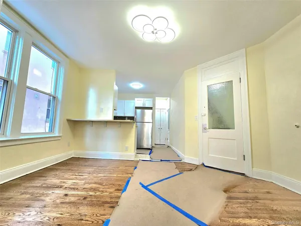 a view of a kitchen with a sink and cabinets