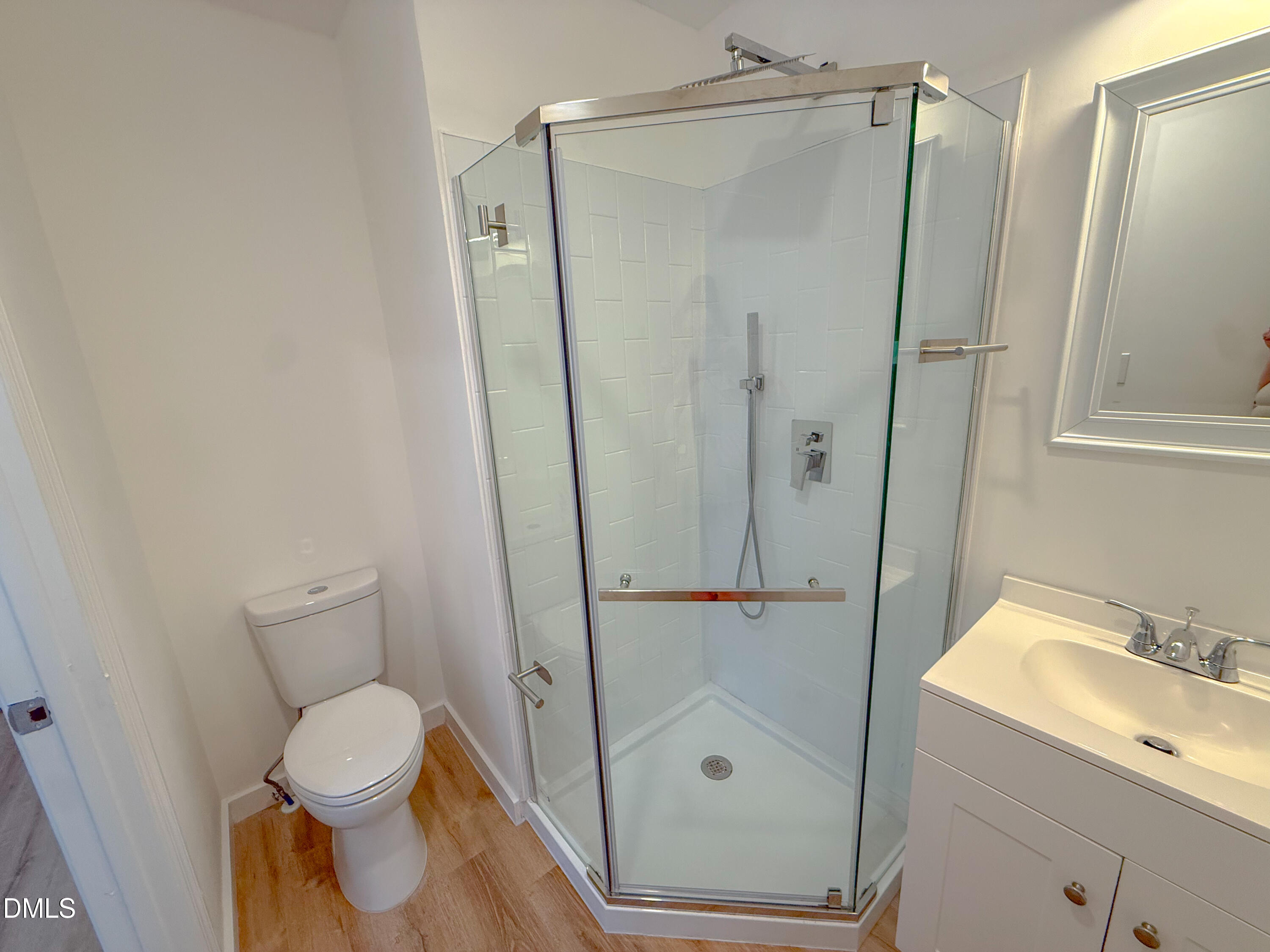 4247 The Oaks Drive Raleigh, NC 27606 - Photo 16 of 21 a bathroom with a shower and a toilet