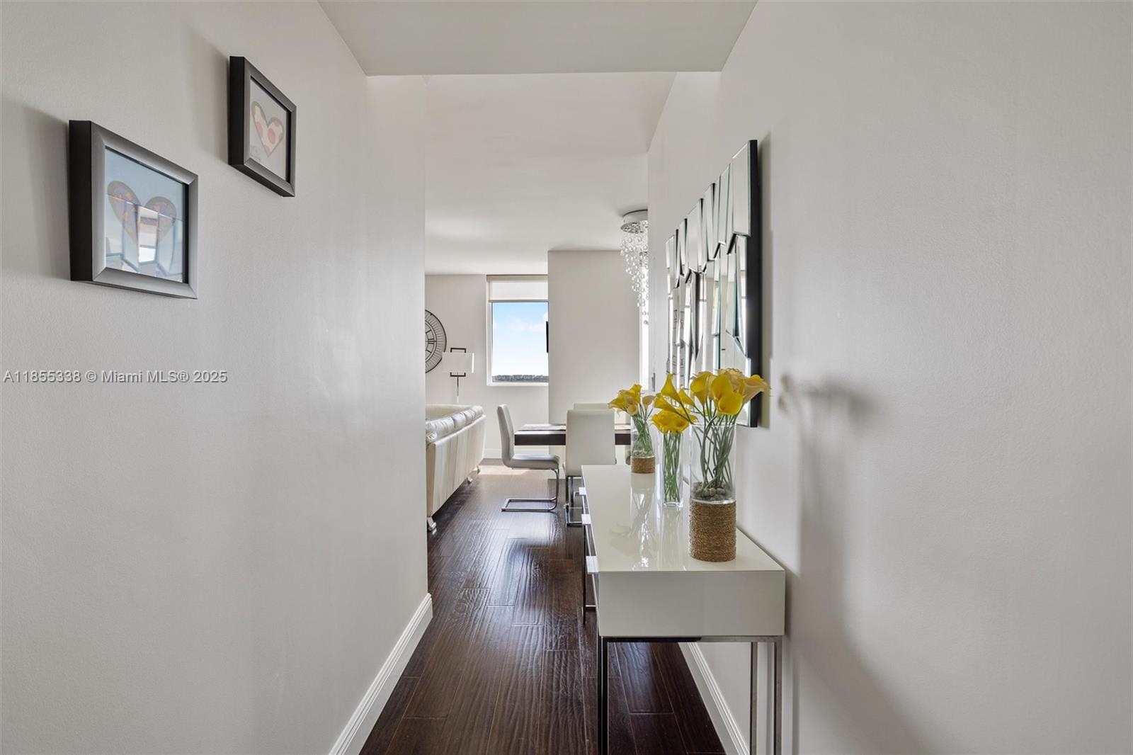 244 Biscayne Boulevard, Unit 1803 Miami, FL 33132 - Photo 16 of 38 a dining room with furniture and wooden floor