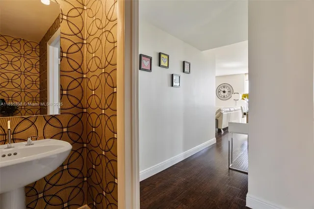 a bathroom with a sink and mirror