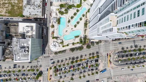 an aerial view of a house with a lake view
