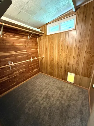 a view of an empty room with a fireplace