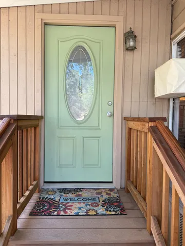 a view of a room with a window and a hallway