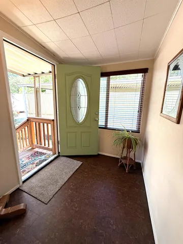 a kitchen with a sink a stove and cabinets