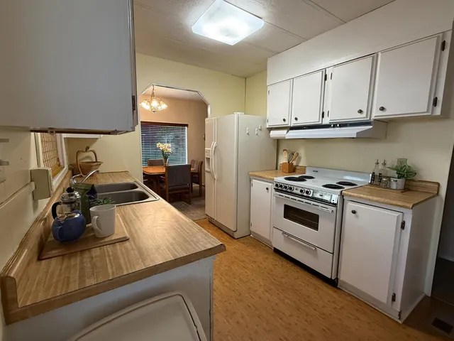 a living room with furniture a window and a table