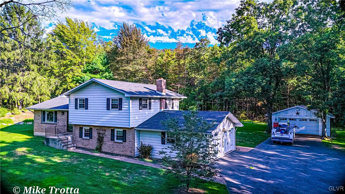 2231 Mountain Road Slatington, PA 18080 - Photo 1 of 41 a house view with a garden space