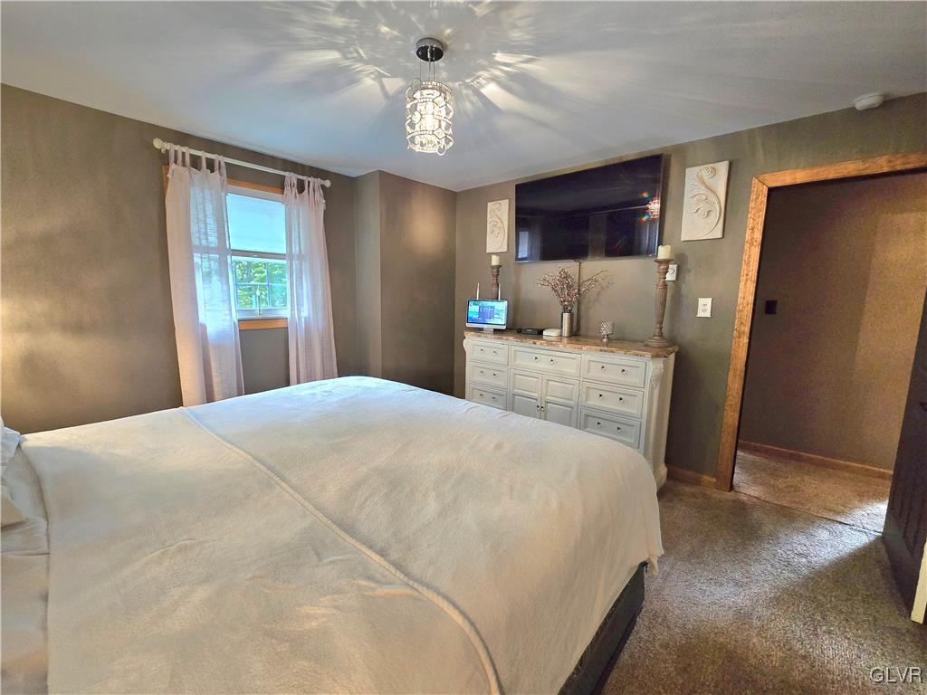 2231 Mountain Road Slatington, PA 18080 - Photo 16 of 41 a bedroom with a bed dresser and a window