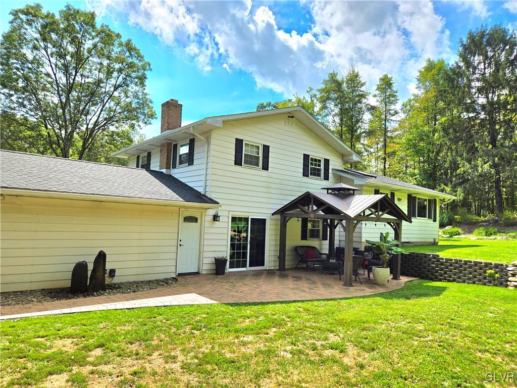 2231 Mountain Road Slatington, PA 18080 - Photo 24 of 41 a front view of a house with garden