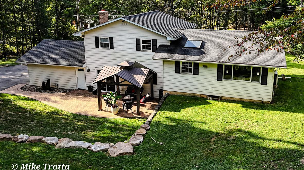 2231 Mountain Road Slatington, PA 18080 - Photo 35 of 41 a view of a house with a yard patio and sitting area