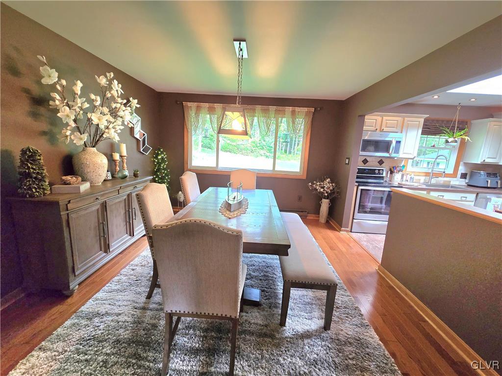 2231 Mountain Road Slatington, PA 18080 - Photo 8 of 41 a dining room with furniture a chandelier and wooden floor