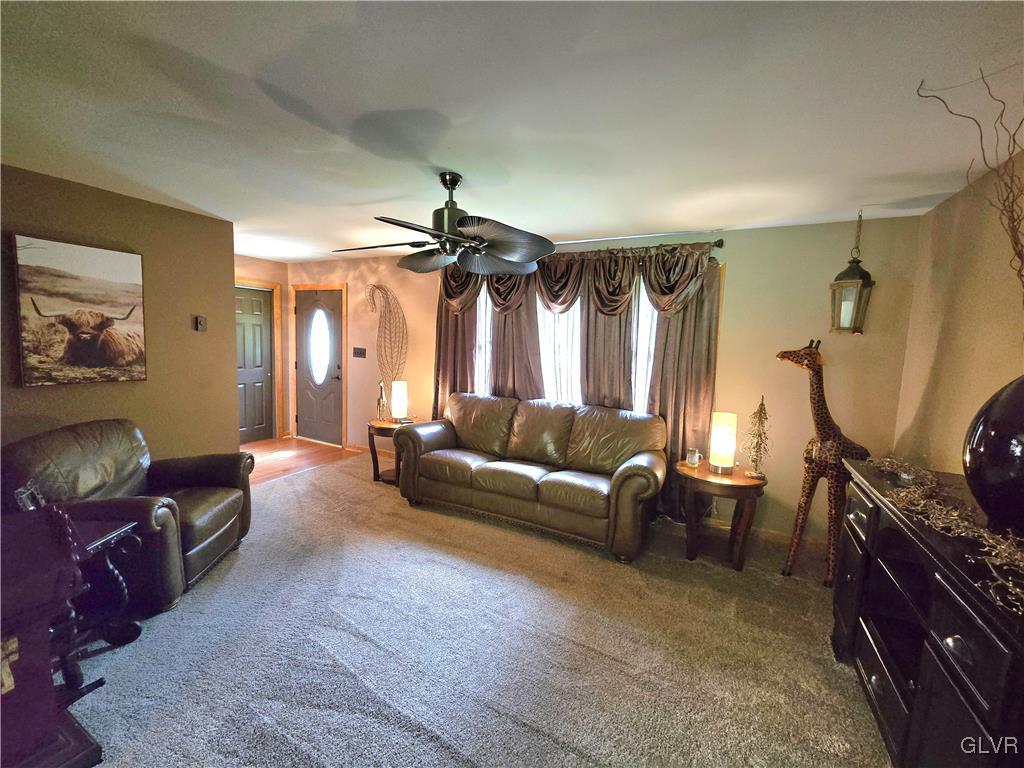2231 Mountain Road Slatington, PA 18080 - Photo 9 of 41 a living room with furniture a ceiling fan and a window