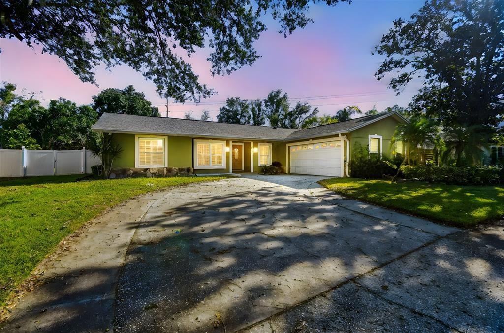 4161 Rolling Springs Drive Tampa, FL 33624 - Photo 1 of 52 a front view of house with yard and green space