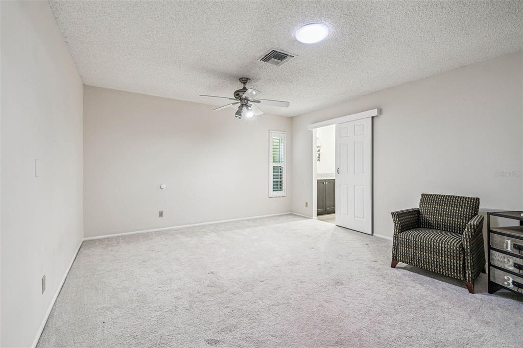 4161 Rolling Springs Drive Tampa, FL 33624 - Photo 24 of 52 an empty room with furniture and a ceiling fan