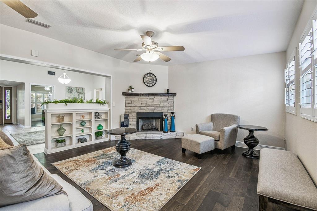 4161 Rolling Springs Drive Tampa, FL 33624 - Photo 29 of 52 a living room with furniture and a fireplace