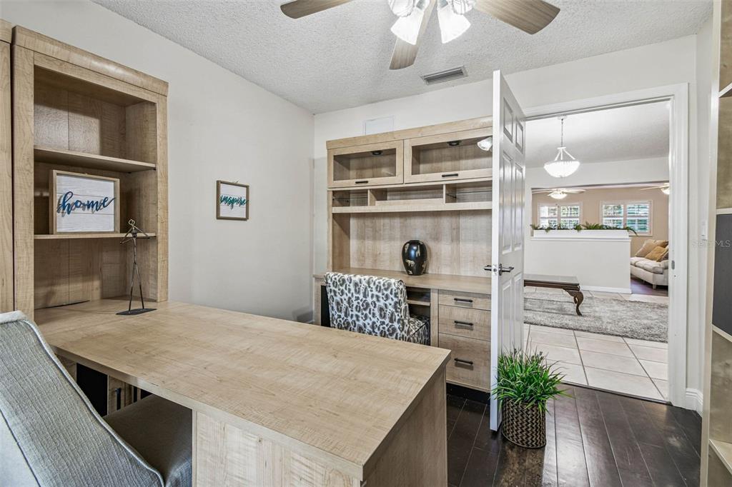 4161 Rolling Springs Drive Tampa, FL 33624 - Photo 44 of 52 a kitchen with a table chairs refrigerator and cabinets